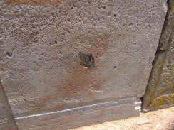 The inset of black stone at the rear of one of the blocks